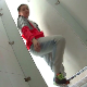 A Japanese woman pisses and shits while squatting over a public floor toilet and video-recorded without her knowledge. Presented in 720P HD. Over 3 minutes.